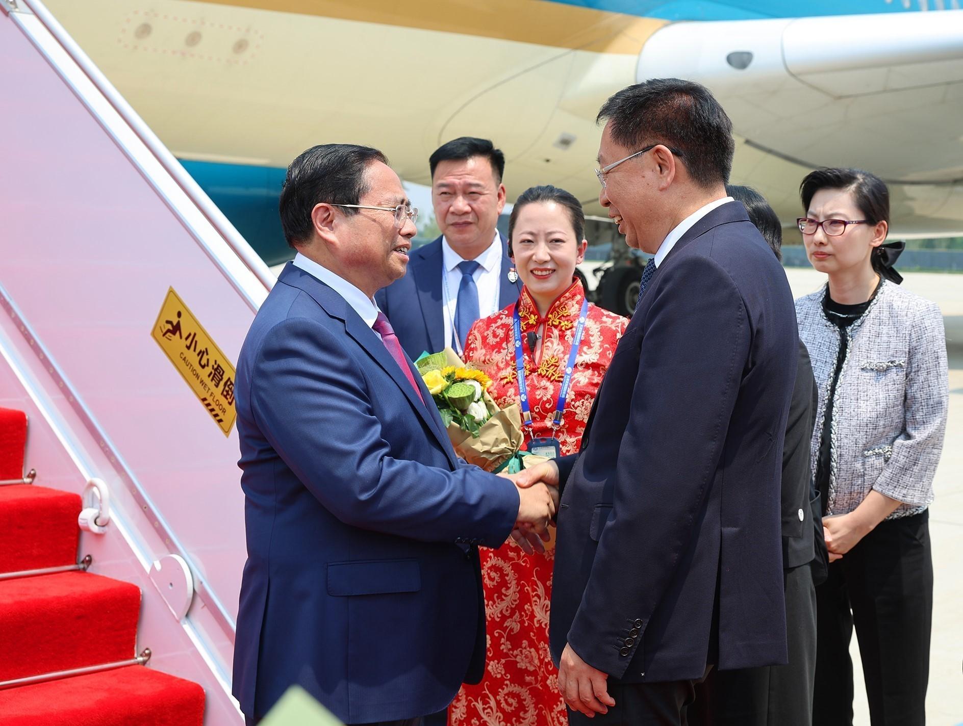 Lễ đón Thủ tướng Chính phủ Phạm Minh Chính tại sân bay quốc tế Tân Hải, thành phố Thiên Tân (Trung Quốc). Ảnh: TTXVN